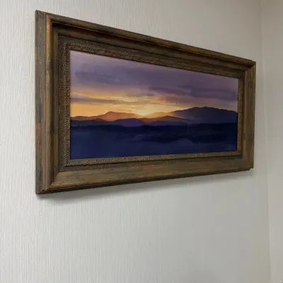 Framed sunset over water landscape painting