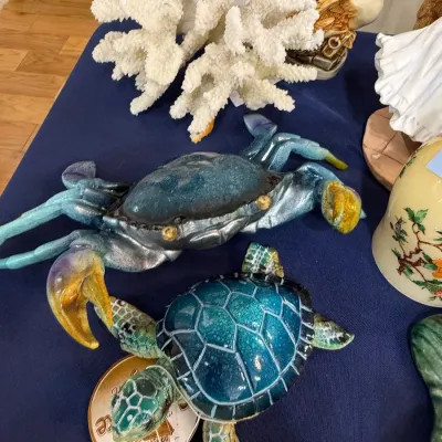 Ceramic crab and sea turtle figurines with white coral