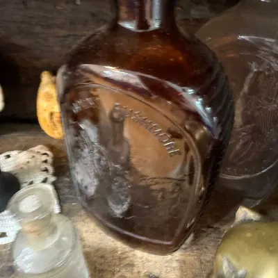 Amber glass Mount Rushmore commemorative flask