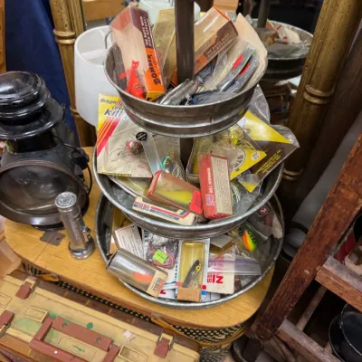 Three tier stand of vintage fishing lures