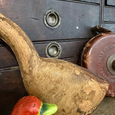 Oversized carved wood display pipe with leather tape measure