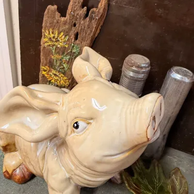 Ceramic pig figurine and painted driftwood art