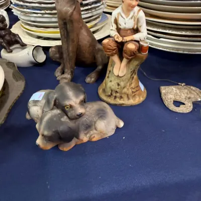 Norman Rockwell boy figurine and puppy figurine