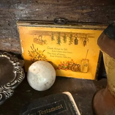 Vintage tin motto plaque, marble egg and New Testament