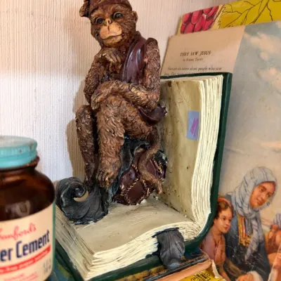 Resin monkey on open book bookend