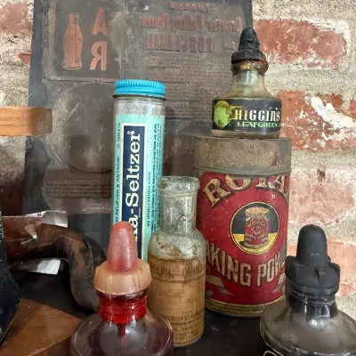 Higgins ink bottles and Royal Baking Powder tin