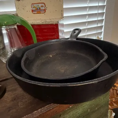 Two antique cast iron skillets