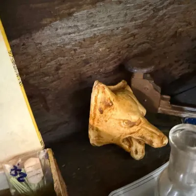 Carved wooden horse head figure