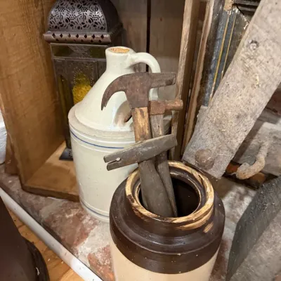 Blue banded stoneware jug and primitive hand tools