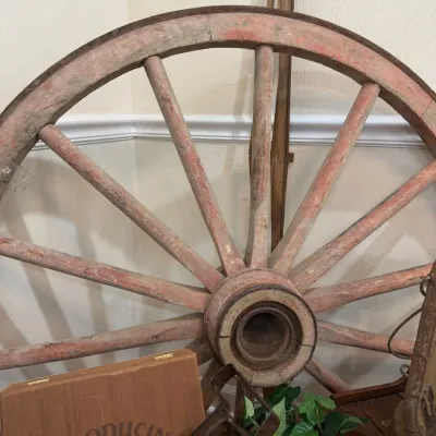 Antique wooden wagon wheel with red paint
