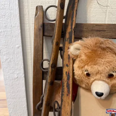 Antique wooden runner sled and Teddy Ruxpin bear