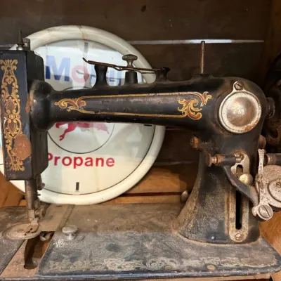 Antique cast iron sewing machine head with gold decals