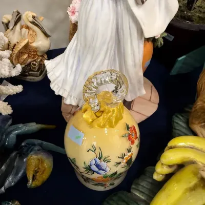 Yellow floral ceramic ewer with applied glass handle