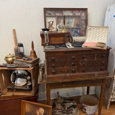Antique machinist tool chest with oil lamp and hand tools
