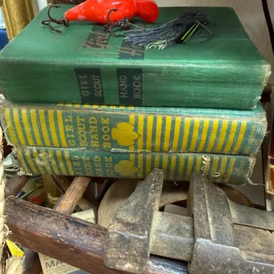 Vintage Girl Scout Handbooks with red fishing lure