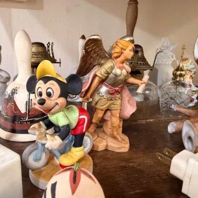 Mickey Mouse figurine with angel and bells