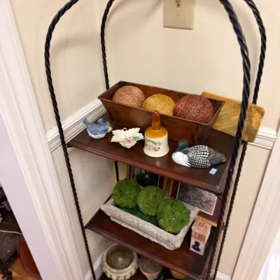 Wrought iron etagere with decorative accents