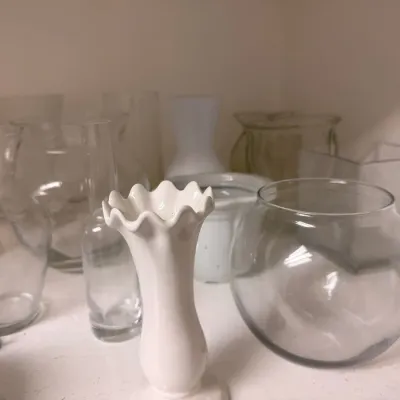 Assorted clear glass and milk glass vases