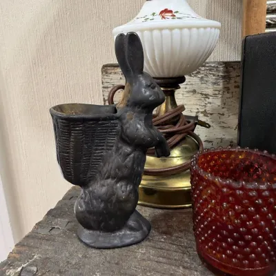 Cast iron rabbit with basket figural planter
