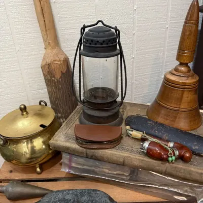 Brass pot, barn lantern and antique hand tools