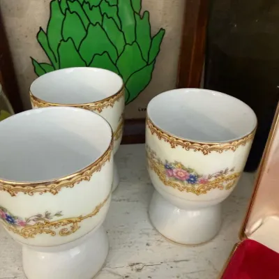 Set of three floral porcelain egg cups