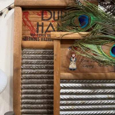 Antique Columbus washboard with peacock feathers