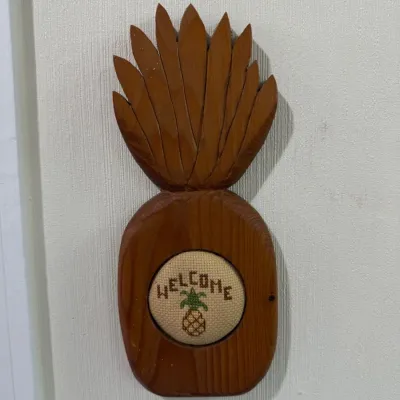 Carved wood pineapple welcome wall plaque