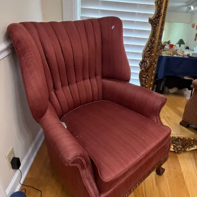 Channel back wingback armchair with carved claw feet
