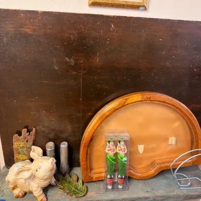 Ceramic pig figurine with arched oak mirror frame