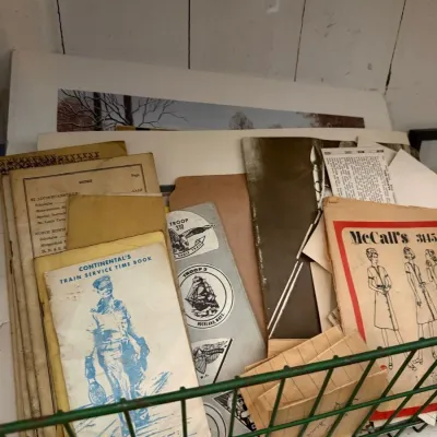 Box lot of vintage paper ephemera and sewing patterns