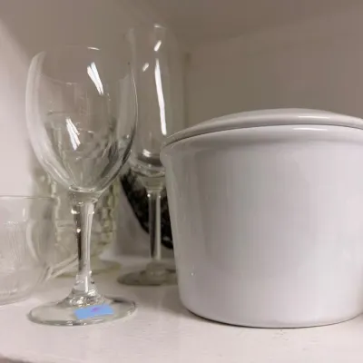 White ceramic lidded crock with stemware