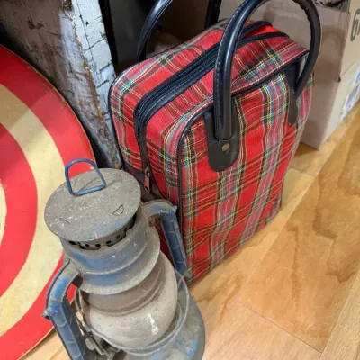 Vintage barn lantern with red tartan travel bag