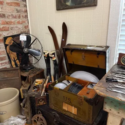 Military footlocker with wooden skis and antique fan