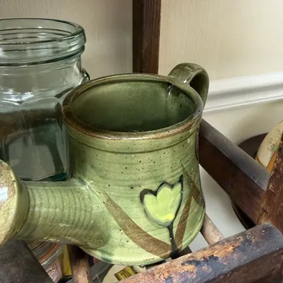 Green glazed studio pottery watering pitcher