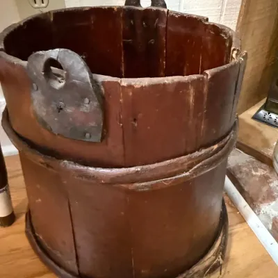 Primitive red painted wooden bucket with iron handles