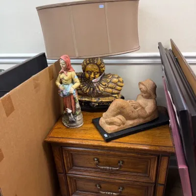 Oak two drawer nightstand with figural lamp