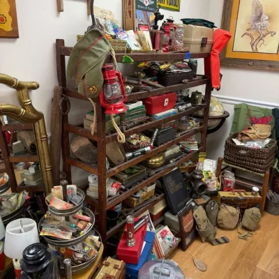 Primitive shelf with vintage tins and red barn lantern