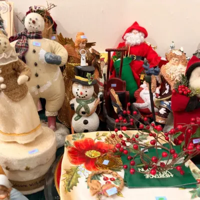 Snowman figurines with holiday serving platters