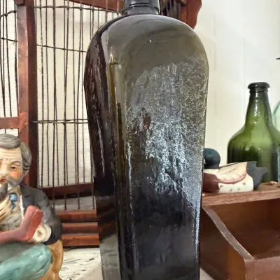 Antique olive green glass case gin bottle
