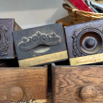 Antique carved drawer fronts and copper printing block