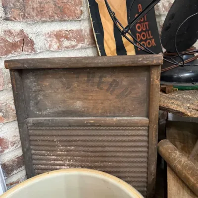 Antique wooden washboard with cut-out doll book