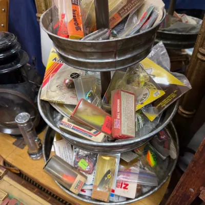 Vintage Bomber and Kill'r fishing lures on tiered stand