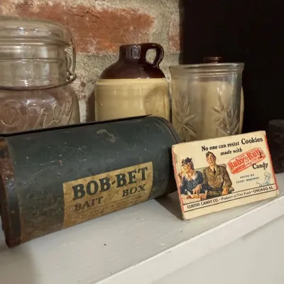 Bob-Bet bait box tin and Baby Ruth advertising sign