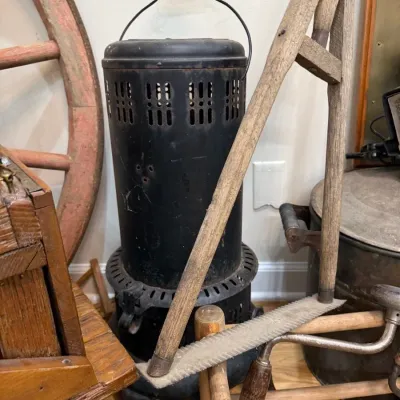 Antique kerosene heater with wire bail handle