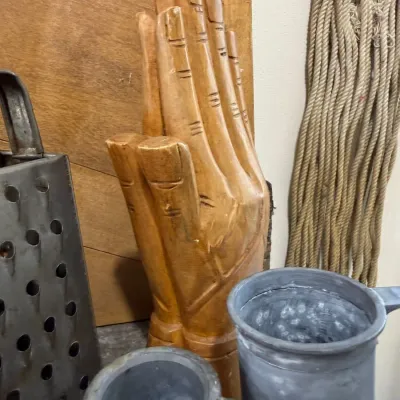 Carved wooden praying hands sculpture