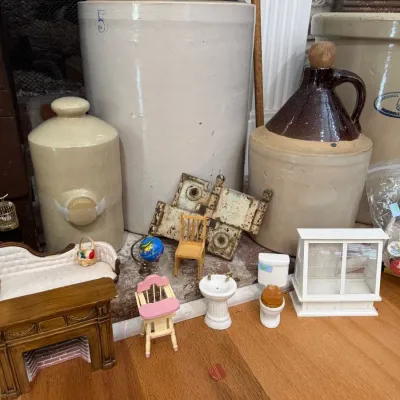 Stoneware crocks and jugs with dollhouse miniature furniture