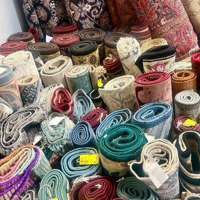 Sale Photo Thumbnail #15: Colorful assortment of smaller rugs and runners.