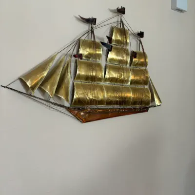 Sale Photo Thumbnail #69: Mid-century modern brass and copper metal wall sculpture of a sailing ship, featuring detailed wire rigging and full sails in the style of Curtis Jeré.