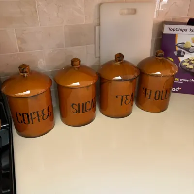 Sale Photo Thumbnail #67: Set of four vintage-style brown glazed ceramic kitchen canisters labeled for coffee, sugar, tea, and flour, circa 1970s.
