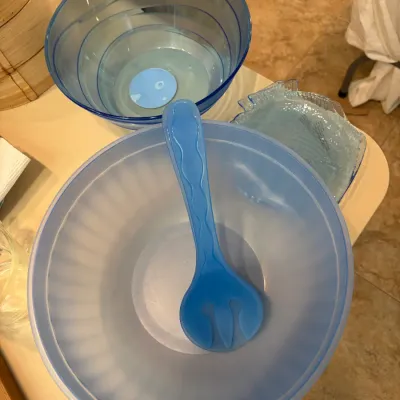 Sale Photo Thumbnail #86: Blue plastic serving bowls, featuring a large frosted bowl with a matching serving fork, a smaller translucent blue bowl, and a fish-shaped dish.